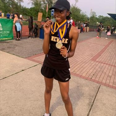 Photo of Annil McIntosh with award medal
